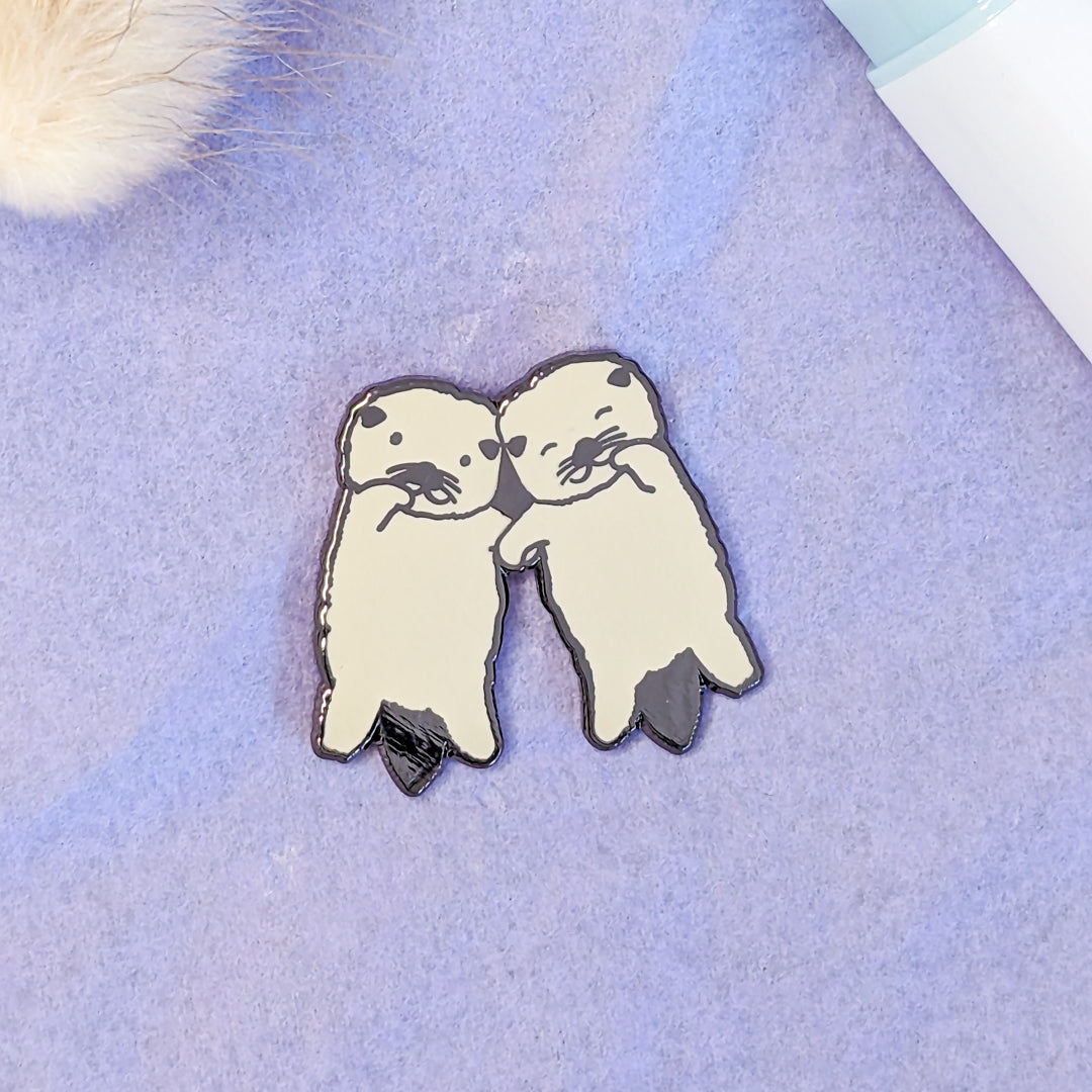 Otters Holding Hands Enamel Pin