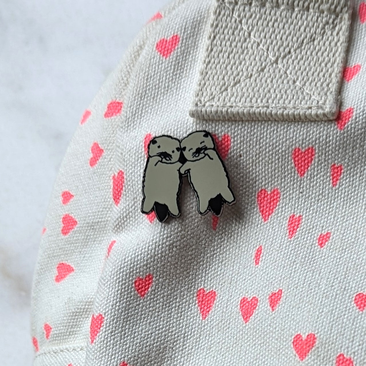 Otters Holding Hands Enamel Pin