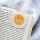 Shine Bright Sunshine Magnetic Bookmark by Craftedvan, inside a book.