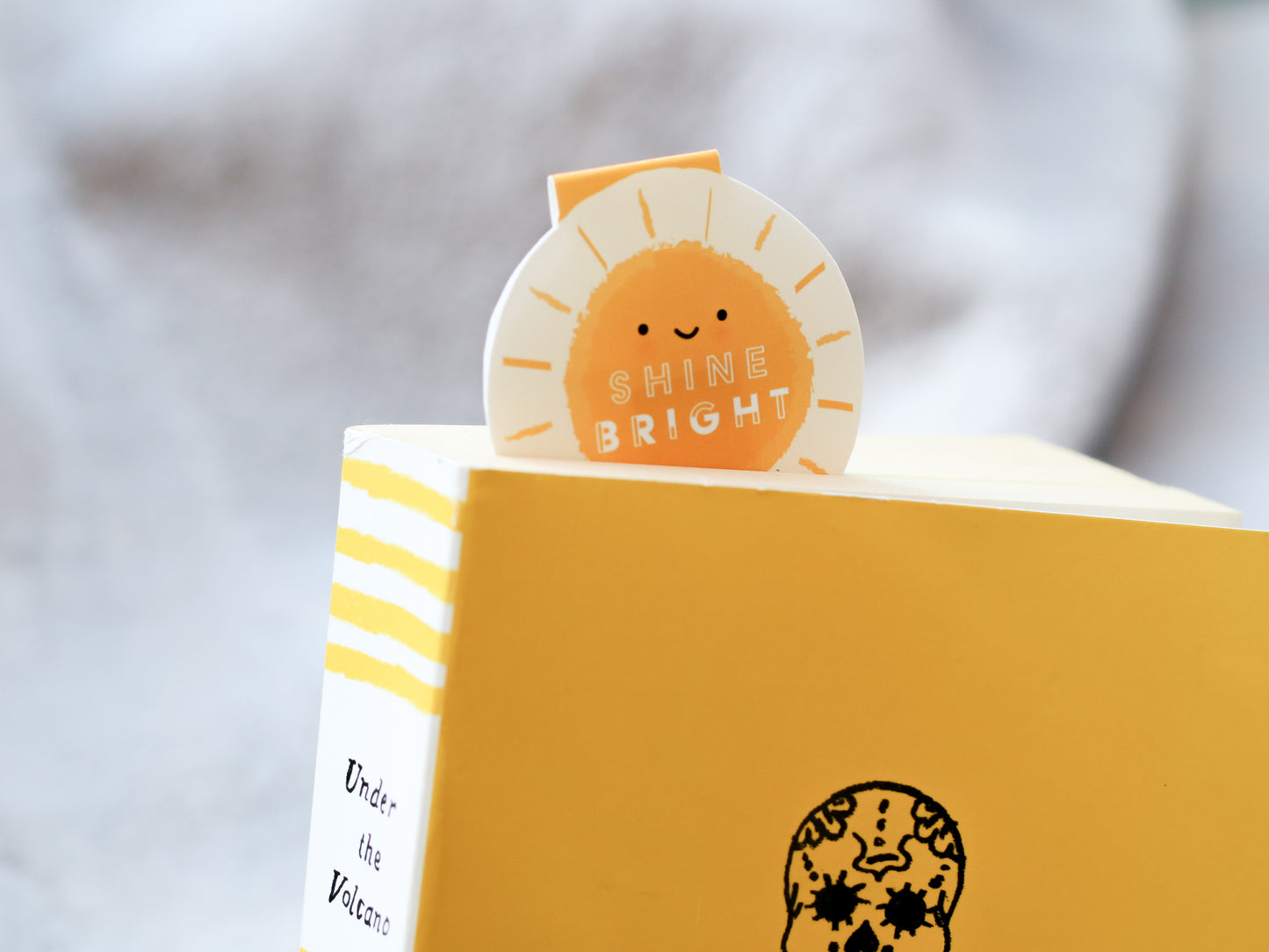 Shine Bright Sunshine Magnetic Bookmark by Craftedvan, tucked inside a book.